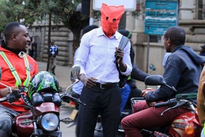 A Nairobi resident uses improvised materials to protect himself from the novel coronavirus.