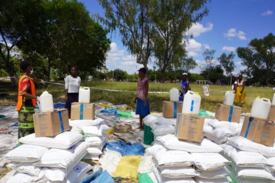 At World Food Programme food distribution points in Zimbabwe, community members stand at least one metre apart and collect their food in groups of five, to prevent overcrowding.