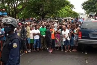 Liberians on the scene where the two LRA employees Albert Peters and Gifty Lamas were discovered dead (file photo)