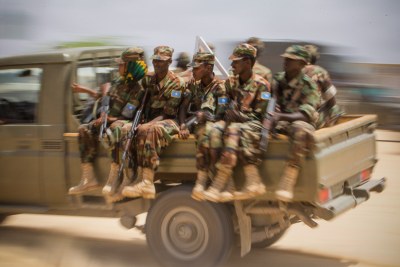 Members of the Somali National Army (SNA) at a passing-out parade on August 14, 2012, at an African Union Mission in Somalia (AMISOM) training facility on the western fringes of the Somali capital Mogadishu.