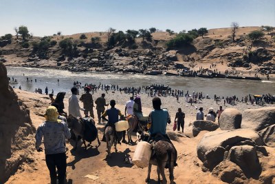 Ethiopian Refugees Crossing - Hamadayet Border The Hamadayet border crossing, where refugees from Ethiopia cross the river into Sudan. New arrivals take whatever belongings they can carry with them, some have their livestock’s and others left with nothing.