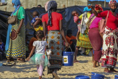 Displaced women receiving dignity kits supported by UNFPA, at Paquitequete beach, Pemba City, Cabo Delgado.