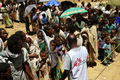 An MSF translator asks people to line up to wait for medical consultations at a mobile clinic in Adiftaw (file photo).