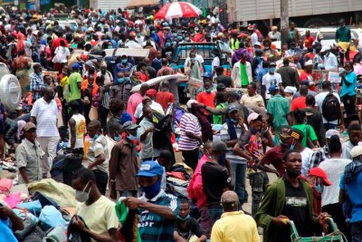 Traders go about their business at Gikomba Market on March 28, 2021, some without face masks and while defying the social distancing requirement for curbing the spread of Covid-19.