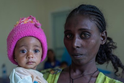 Yeshialem Gebreegziabher, 27, holds her daughter, Kalkidan Yeman, 6 months old, who is suffering from malnutrition at Aby Adi Health center in the Tigray region of northern Ethiopia