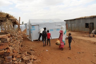 Eritrean refugees arrive in Adi Harush camp, after being relocated from other camps in the north of Ethiopia’s Tigray region that were destroyed in the early months of the conflict.