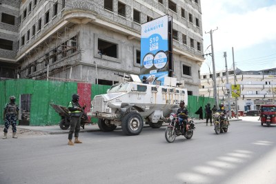 Police officers serving under the African Union Mission in Somalia (AMISOM) patrol a street in Mogadishu, Somalia, on May 29, 2021.