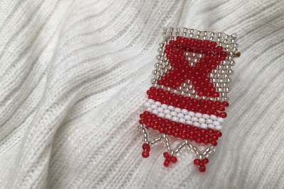 An HIV awareness pin.