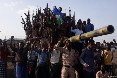 Dozen of armed people on a tank in an unidentified area of Ethiopia.