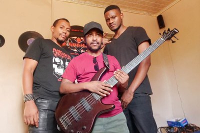 Musicians from Humanitarian heavy metal band pose for a photo in Lobatse village outside Gaborone, Botswana (L to R Hank Tawana, Humano and Martin Beats). November 23, 2021.