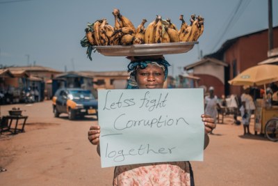 A female fruit vendor demonstrates against corruption in Ghana.