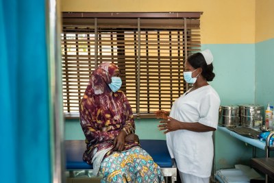 A nurse counsels a patient before she gets screened (file photo).