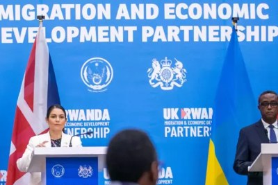 Rwanda’s Minister for Foreign Affairs and International Cooperation Dr Vincent Biruta and the United Kingdom’s Home Secretary Priti Patel address the media after signing the five-year deal on relocation of migrants and asylum seekers in Kigali on April 14, 2022.
