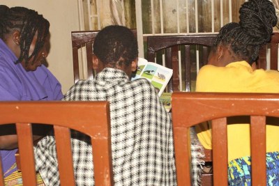 Two young victims of human trafficking, who were rescued from the Dzaleka Refugee Camp, receive support at a shelter in Malawi.