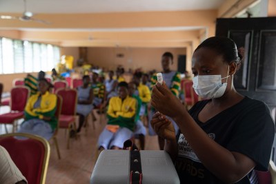 A health worker prepares to vaccinate a student in Adukrom in the Eastern Region, Ghana (file photo).