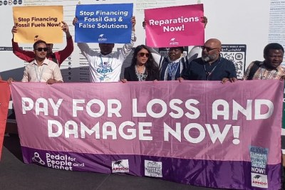 Activists at COP27 protesting against the continued use and development of fossil fuels.