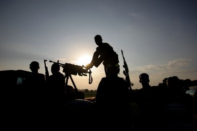 Soldiers of the Somali National Army (SNA) are silhouetted against the setting sun (file photo).