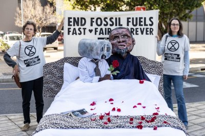 Extinction Rebellion Cape Town staged a protest outside the Africa Oil Week at the Cape Town International Convention Centre to oppose the government’s push to develop more fossil fuels.