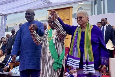 Liberia’s former two leaders – President Johnson Sirleaf and President Weah – hand in hand with newly inaugurated President Boakai.