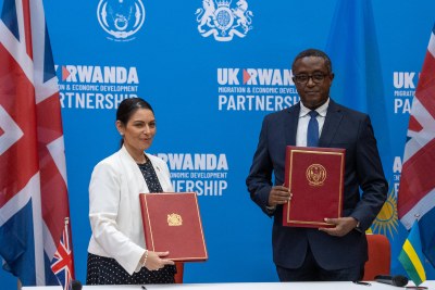 Home Secretary Priti Patel and Minister Biruta sign the migration and economic development partnership between the UK and Rwanda.