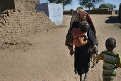 Children walk to their shelter at an IDP camp near El Fasher, the capital of North Darfur, Sudan. (file photo)