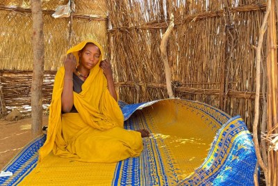 Fleeing an attack by armed men in El Geneina, capital of Sudan's West Darfur State, that killed her husband, 22-year-old Zeinab and her two children found refuge in a displaced persons camp in neighboring Chad.