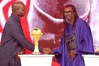 Senegal’s former coach, Aliou Cissé, with two-time Oscar-nominated actor and co-host of the AFCON draw Djimon Gaston Hounsou.