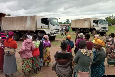 People affected by Cyclone Jude wait for relief items in Mulanje district, Malawi, on March 13, 2025.