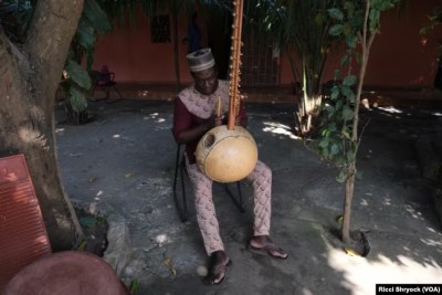 Nino Galissa, a seventh-generation griot - or oral historian - composed the musical version of the Kansala 2024 excavation report. Here, he plays a traditional instrument known as a kora at his home in Bissau, Guinea-Bissau, Nov. 28, 2024.