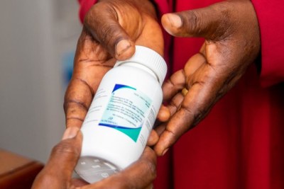 A patient in Tanzania receives antiretroviral medication to treat HIV.