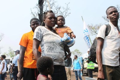 Families who fled militia attacks in Kasai Province in the Democratic Republic of the Congo arrive at the newly established Lóvua settlement in northern Angola.