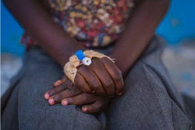 Rachel, 7, sits outside the UNICEF-supported cholera treatment centre in Kihumba, Idjwi health zone, South Kivu province, DR Congo, on 1 May 2025.
