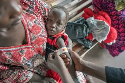 A child is checked for malnutrition at the UNICEF-supported nutrition clinic at Kimu Primary Healthcare Centre in Juba, South Sudan.