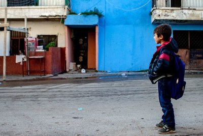 Brandt A boy walks through a neighborhood of Tripoli, Libya's capital.