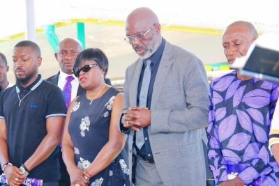 Former President Weah at the reburial ceremony of his late father.