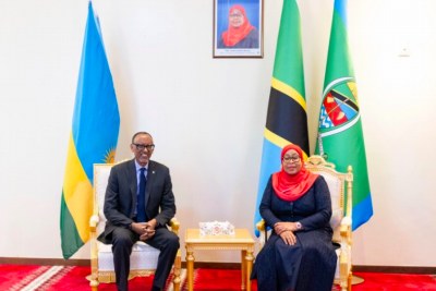 President Paul Kagame interacts with President Samia Suluhu Hassan in Dar es Salaam.